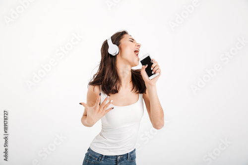 Portrait of a satisfied girl dressed in tank-top