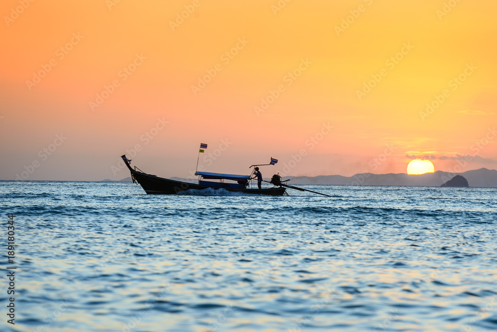 Naklejka premium Long tail boat at dusk. Thailand.