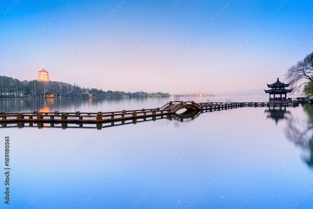 Fototapeta premium Landscape of West Lake. Long Bridge and Leifeng Pagoda. Located in Hangzhou, Jiangsu, China.