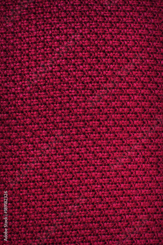 Red fabric. Knitting. Background of fabric. Close-up. Texture