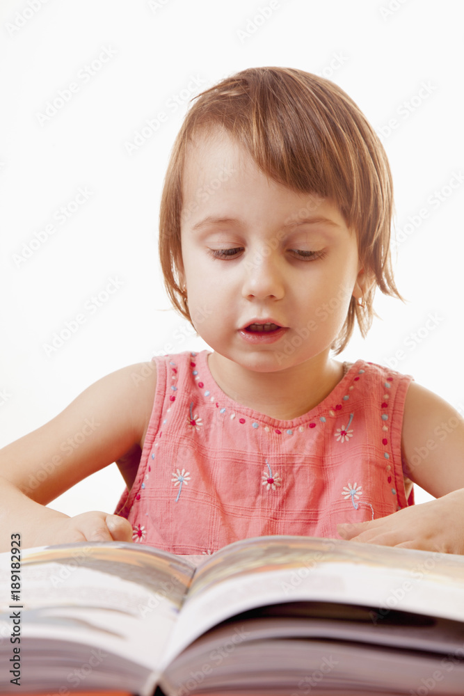 little baby girl reading a book (development, education) little baby girl reading a book (development, education)