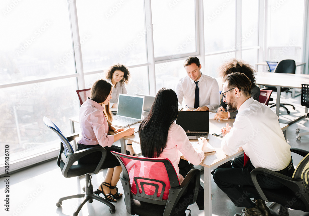 Business team during project creation. Discussing task in luxury office. Business team during project creation. Discussing task in luxury office.