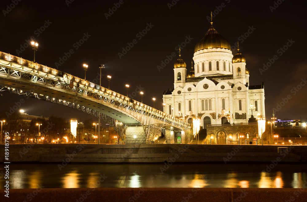 Moscow, Russia. Cathedral Of Christ Savior With Bridge With Illumination By Lamps At Winter Night. Famous Christian Landmark In Russia.
