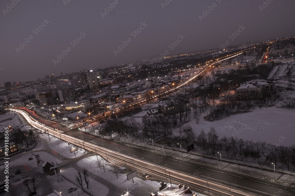 night city view with transport interchange, lights and traffic 