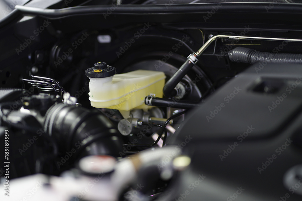Close up of brake fluid tank inside the car engine. Close up of brake fluid tank inside the car engine.