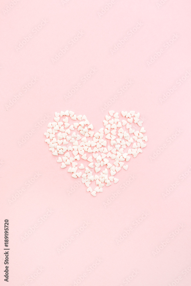 Valentine's Day composition. Heart on pale pink background. Flat lay, top view Love concept.