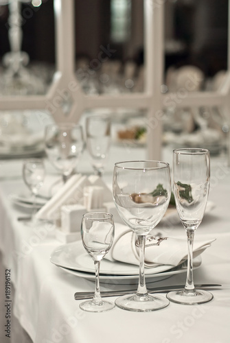 Glass dishes on a table on a white tablecloth