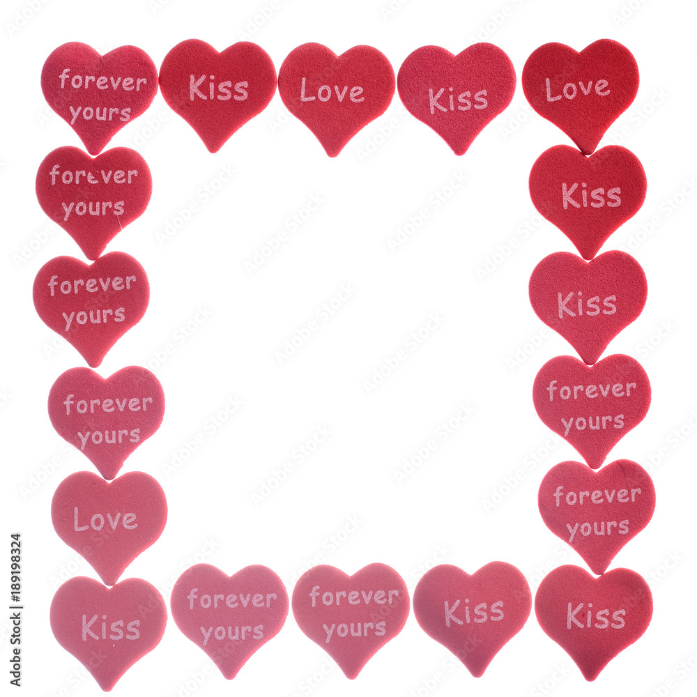 Red hearts confetti on white background with words love kiss