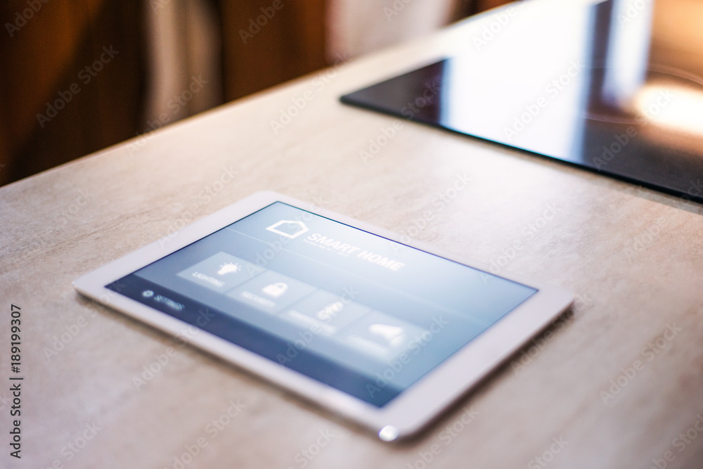 A tablet with smart home screen. A tablet with smart home screen.