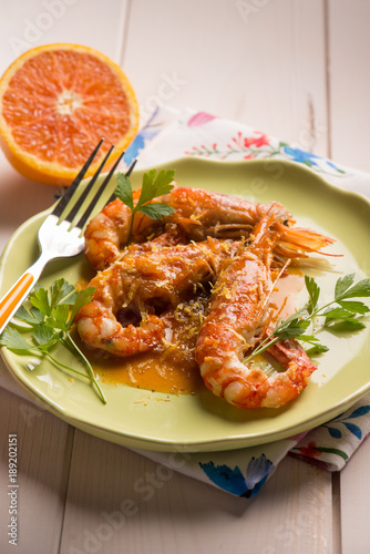 shrimp with orange and lemon sauce, selective focus