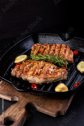 Grilled pork steak in grill pan
