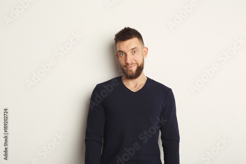 Emotional man posing on white background
