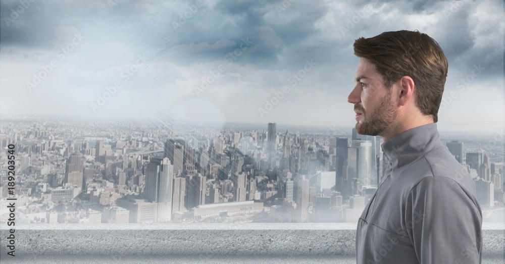 Man looking left with skyline in background Man looking left with skyline in background