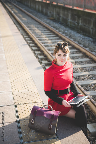 young beautiful red dressed vintage hipster woman