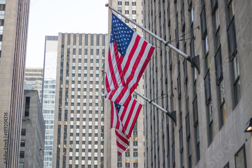 American flag flying with blue sky background