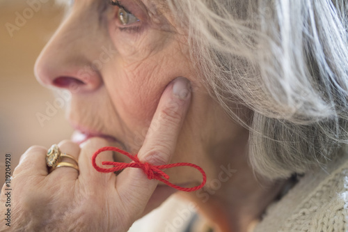 Photography Close Up Of Senior Woman With String Tied Around Finger As Reminder