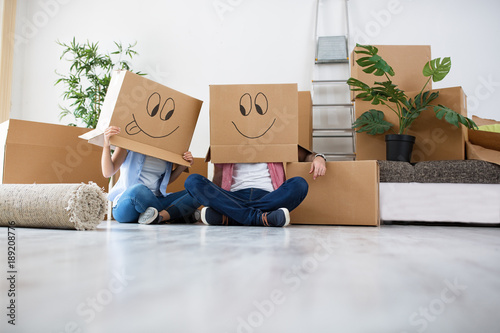 Funny young couple enjoy and celebrating moving to new home