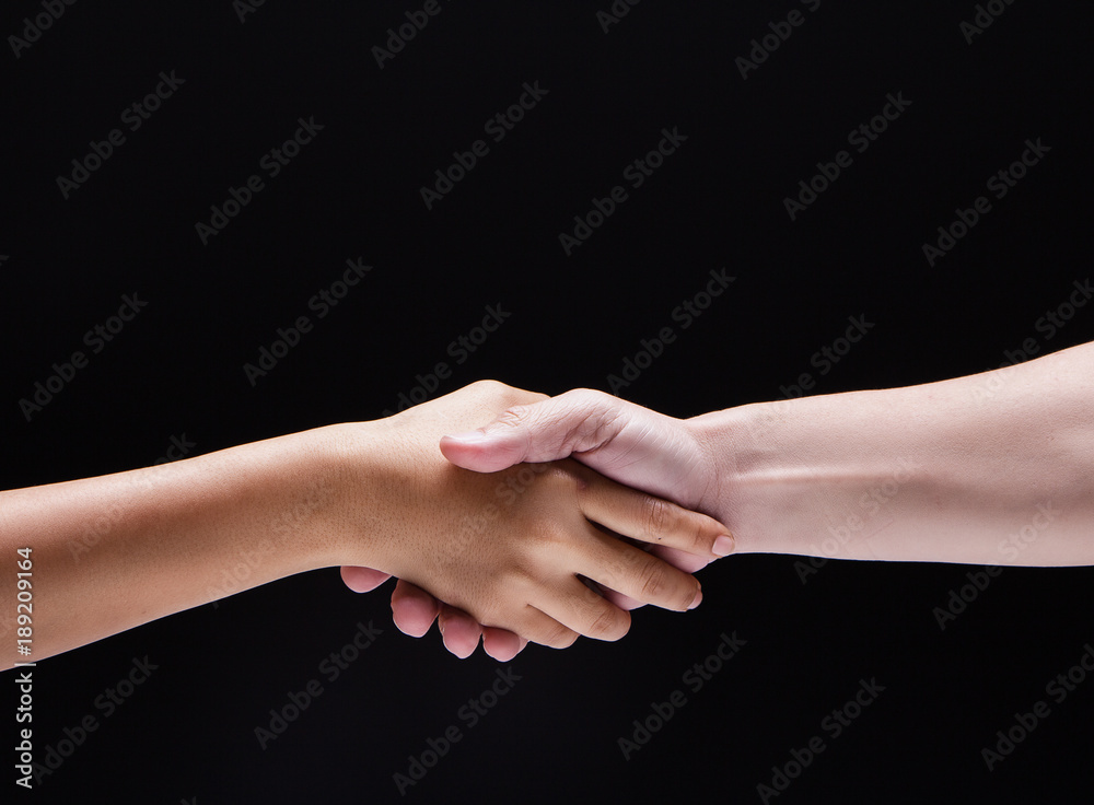 Closeup human hand touch together.They are shaking hand to be sign for trust and teamwork,the collaborate concept