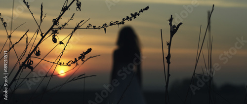 girl walking on the sunset