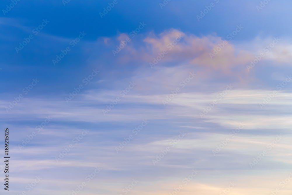 the sky with unusual clouds in the form of horizontal stripes at the bottom and purple clouds at the top, can serve as a background or an inset in the landscape_