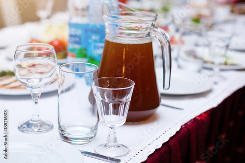 Beautiful glasses defocused on buffet table in restaurant and blurred background