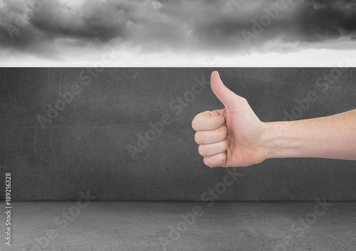 Thumbs up with dark wall