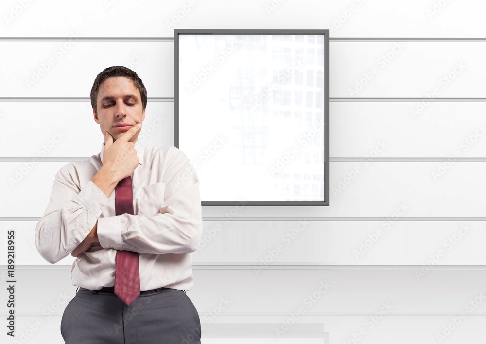 Fotografie Businessman thinking with board on wall