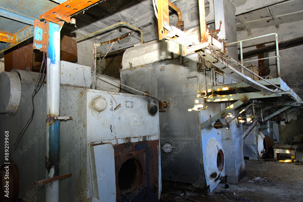 Old equipment for milk production. Premises of a destroyed and plundered milk production plant. The raiders captured the plant. Vandalism. Ukraine, January 2018. Old equipment for milk production. Premises of a destroyed and plundered milk production plant. The raiders captured the plant. Vandalism. Ukraine, January 2018.