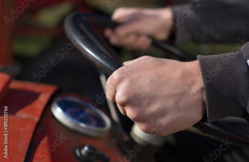 Farmer driving tractor