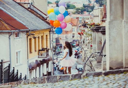 Girl with colorful latex balloons © oksix