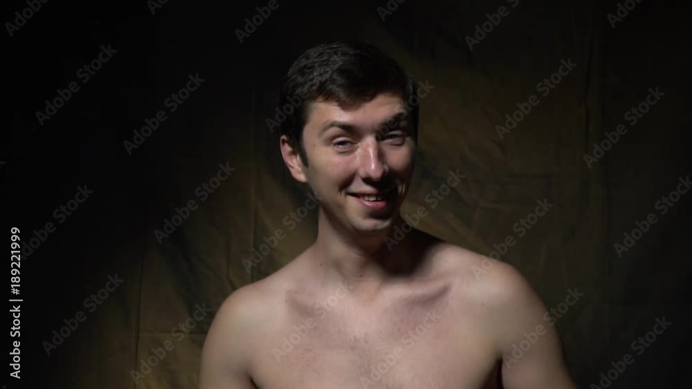 The man tries to stop laughing