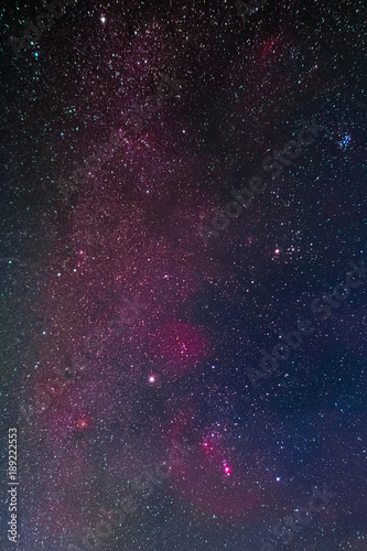 Winter night sky including Barnard’s Loop, the Orion Nebula, the Flame Nebula, the Rosette Nebula, the California Nebula, and the Pleiades as seen from Battenberg in the Palatinate Forest in Germany.