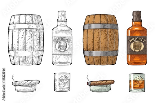 Whiskey glass with ice cubes, barrel, bottle and cigar.