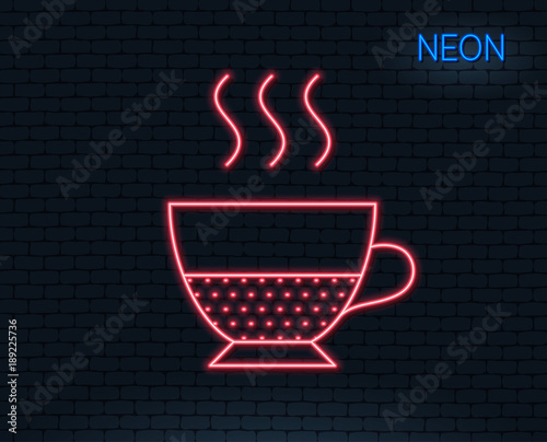 Neon light. Doppio coffee icon. Hot drink sign. Beverage symbol. Glowing graphic design. Brick wall. Vector