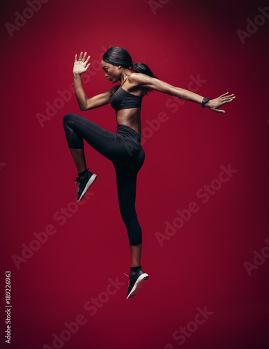 Sports woman jumping and stretching