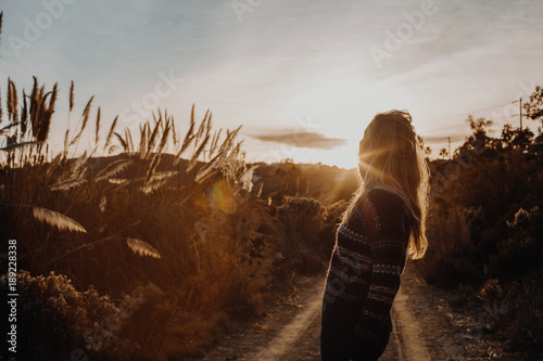 Quadro su tela Woman in Sweater in Canyon with Golden Hour Light