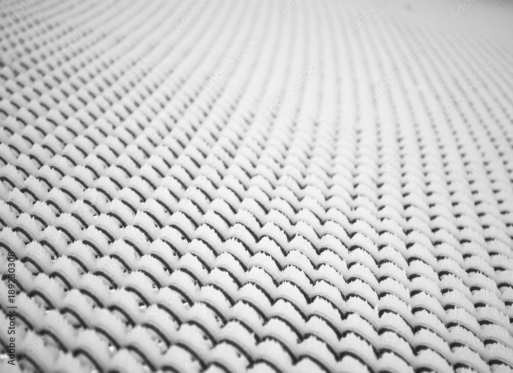 Lattice fence covered with snow. Winter time. Abstract background Lattice fence covered with snow. Winter time. Abstract background