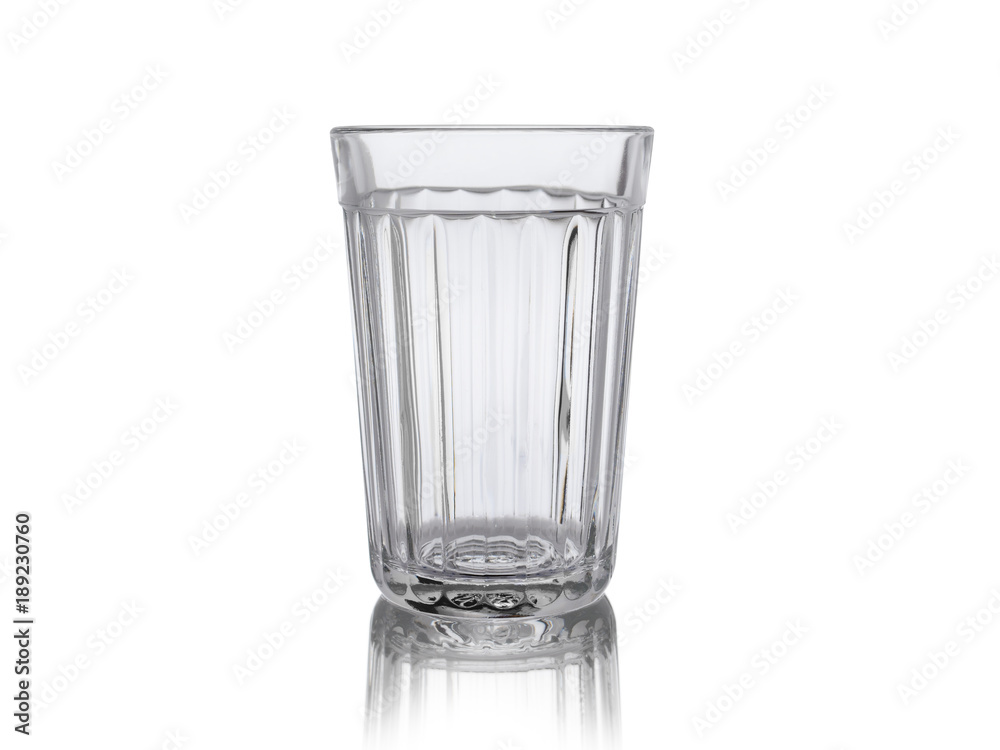Empty faceted glass with reflection, isolated on white background Empty faceted glass with reflection, isolated on white background