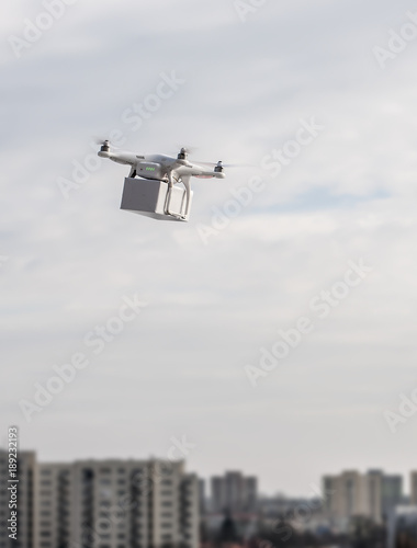 Technological delivery innovation - fast drone delivery concept above town