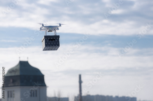 Technological delivery innovation - fast drone delivery concept above town