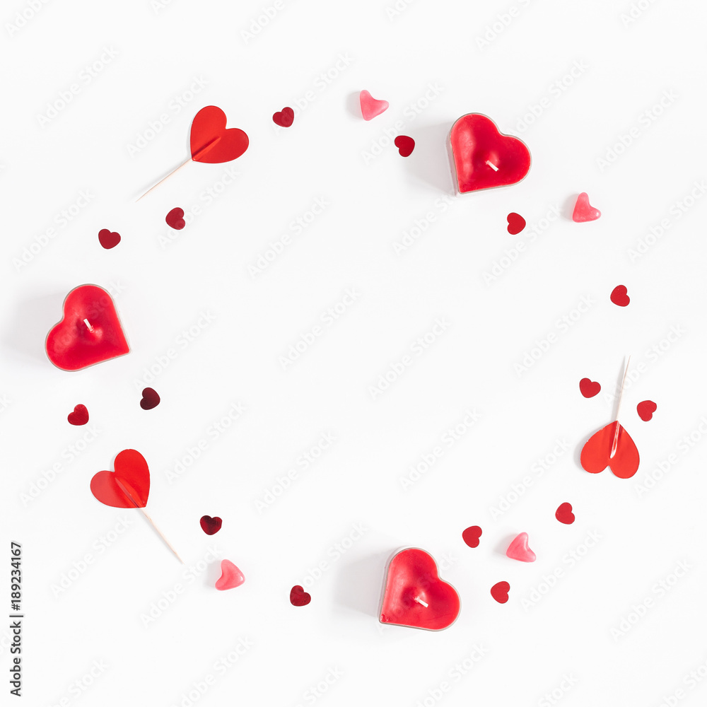 Valentine's Day. Frame made of candles, confetti on white background. Valentines day background. Flat lay, top view, copy space, square