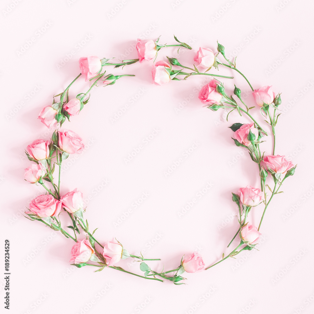 Flowers composition. Wreath made of pink rose flowers on pink background. Flat lay, top view, copy space, square Flowers composition. Wreath made of pink rose flowers on pink background. Flat lay, top view, copy space, square