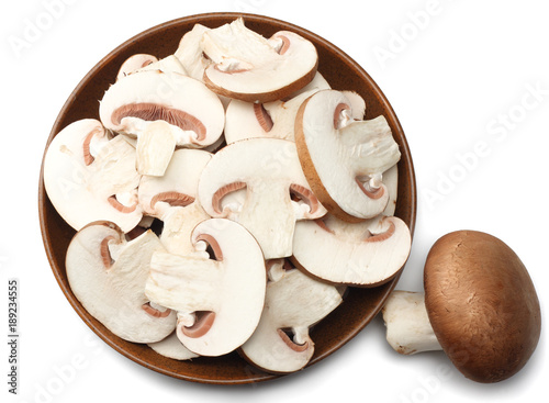 Fresh champignon mushrooms isolated on white background. top view