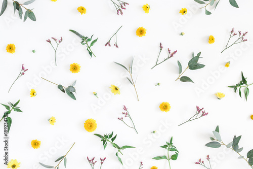 Flowers composition. Pattern made of yellow and pink flowers on white background. Flat lay, top view © Flaffy