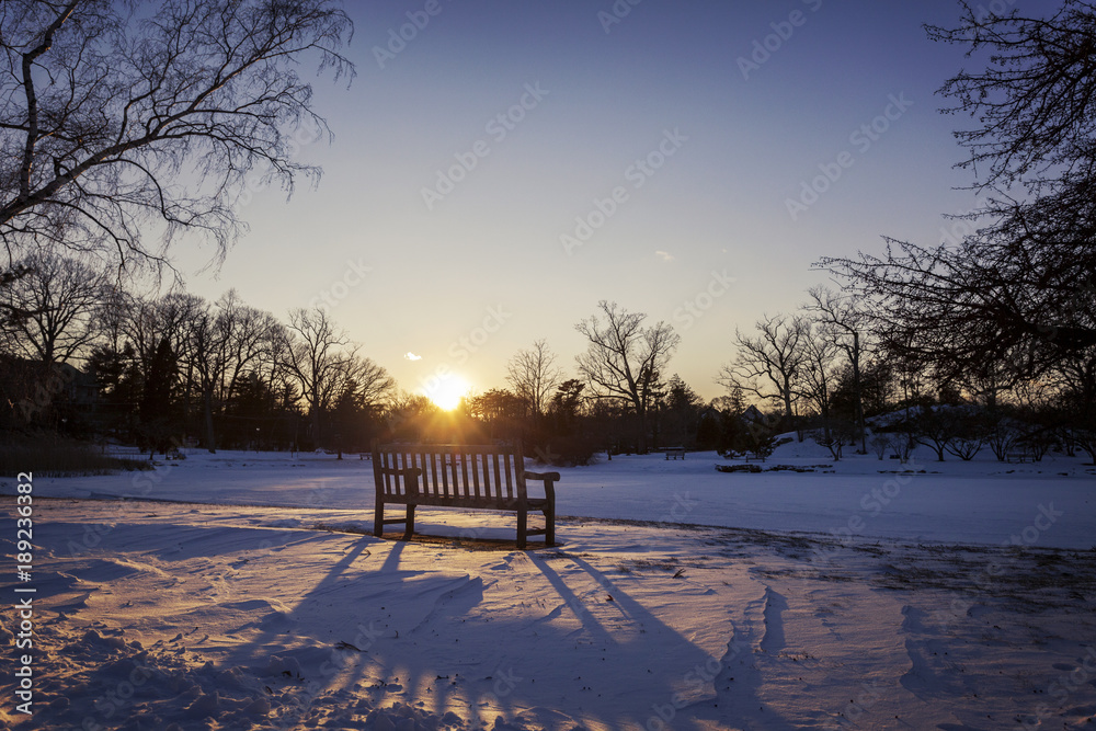 Winter sunset and a bench