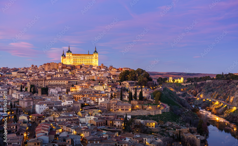Panoramic view of the medieval center of the city of Toledo, Spain. It features the Tejo river, the Cathedral and Alcázar of Toledo.