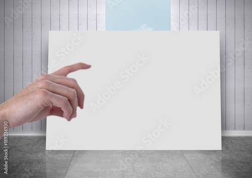 Hand pointing at white board