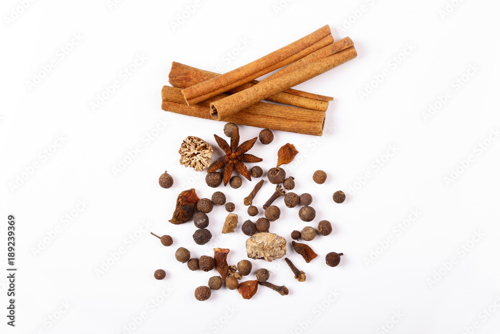 Spices for mulled wine. Spices for mulled wine isolated white background. Cinnamon sticks, roast pepper, ginger, tubberry, nutmeg, cardamom, cloves. Spices for mulled wine. Spices for mulled wine isolated white background. Cinnamon sticks, roast pepper, ginger, tubberry, nutmeg, cardamom, cloves.