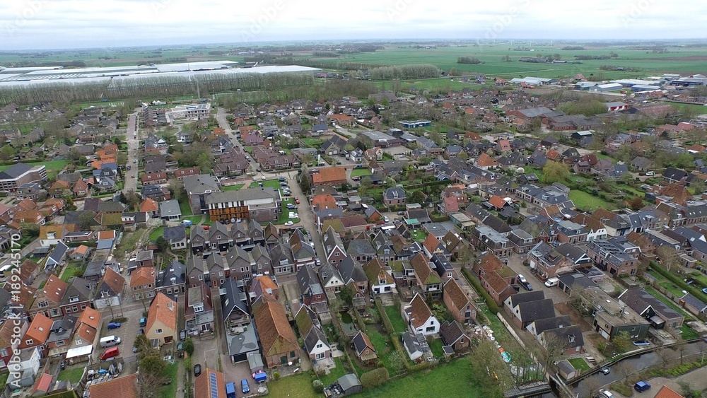Typical dutch village in the east of Holland seen from above by a Drone