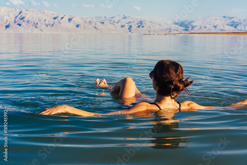 Girl is relaxing and swimmi...